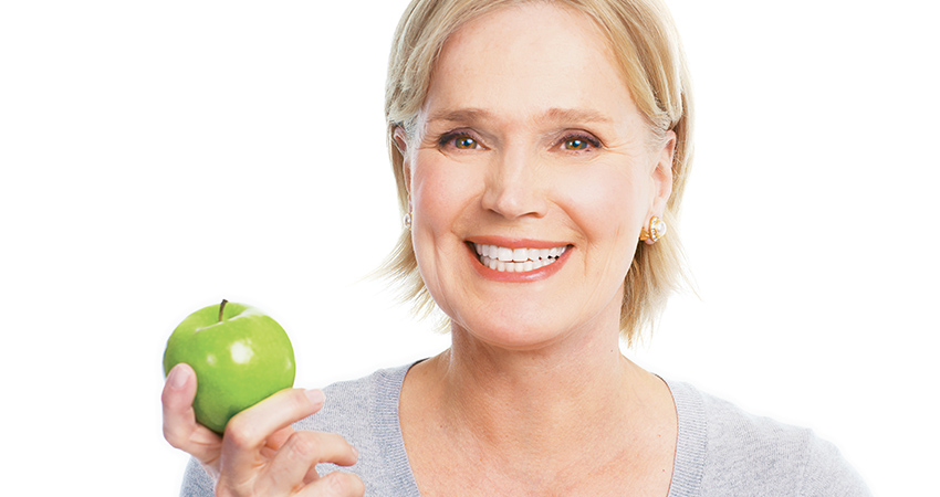 lady smile and holding green apple in their hand