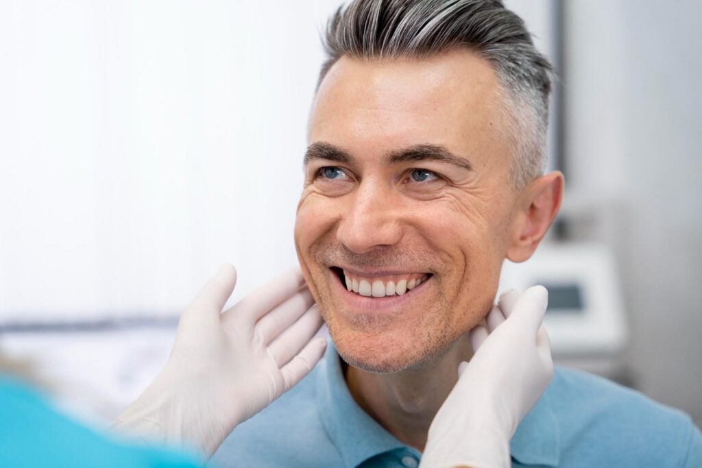 Close-up of a doctor checking a patient during a dental examination.