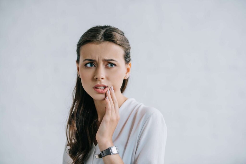 Woman with teeth pain.