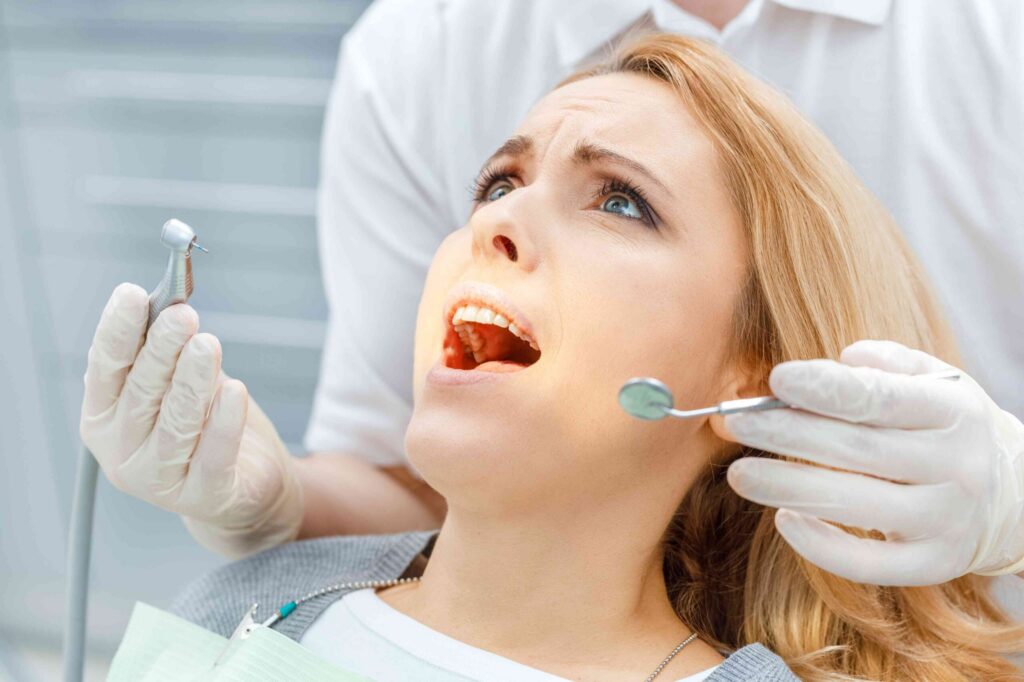Patient receiving a dental crown examination.