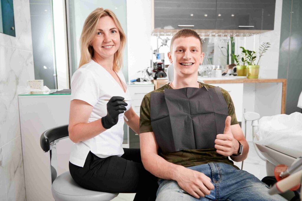 Patient smiling after a dental checkup.